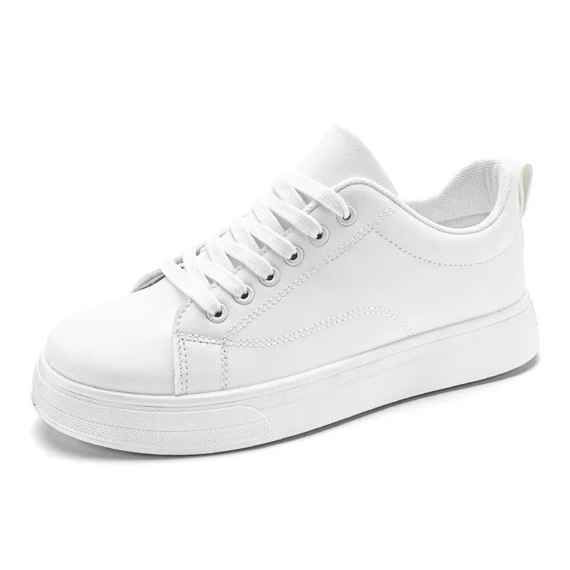 Men's low-top casual sneakers in black, white, or black with white bottom, showing round toe and flat rubber sole.