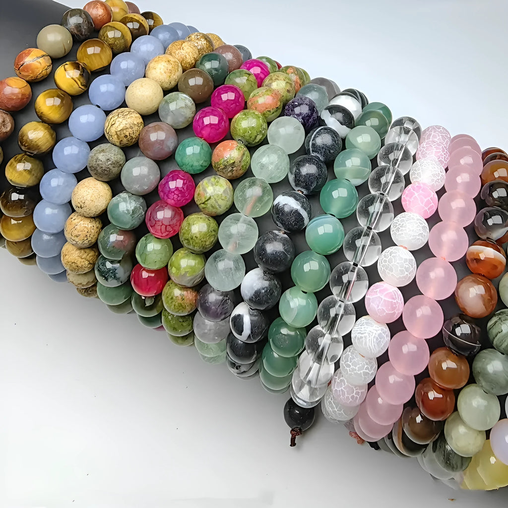 Natural 8mm polished crystal stretch bracelet with amethyst beads on a white background