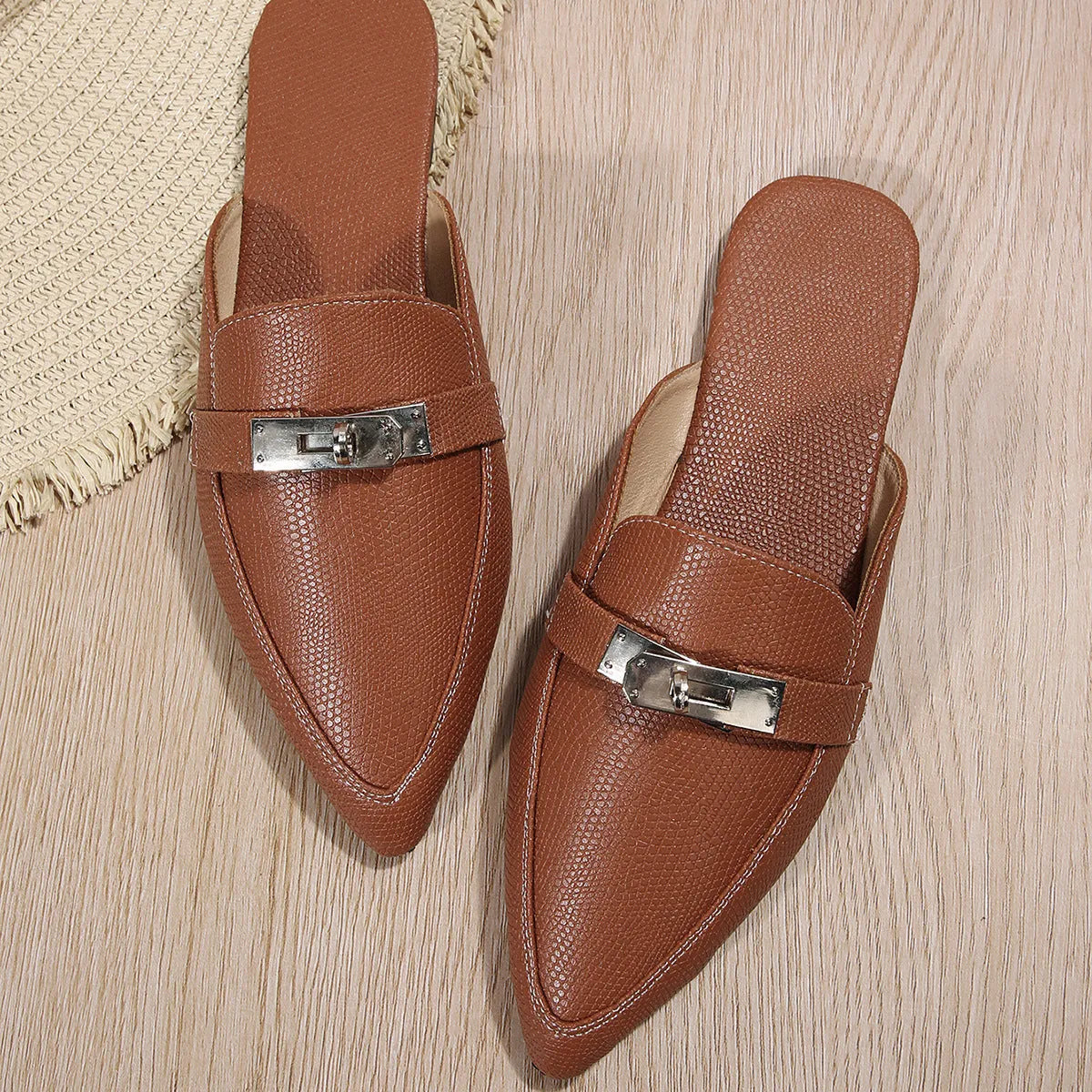 Light brown women's pointed-toe low heel semi-slippers with a PU upper and rubber sole.