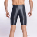 Men's shiny black nylon sports shorts laid flat, plus size range up to XXL.