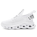 Children's black velcro sneakers with fabric upper and thick EVA sole on a white background.