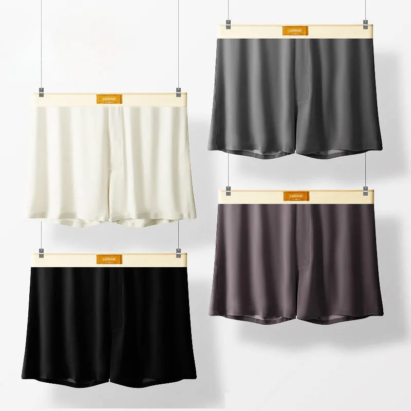 Men's solid colour loose fit ice silk boxer shorts on a mid waist, shown in dark grey.