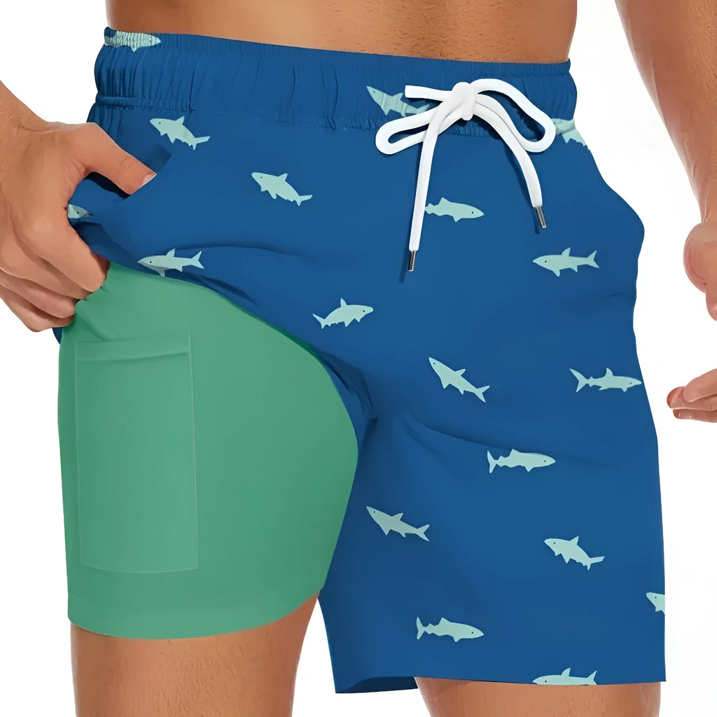 Men's straight-leg beach shorts with shark figure design and drawstring waist in blue colour