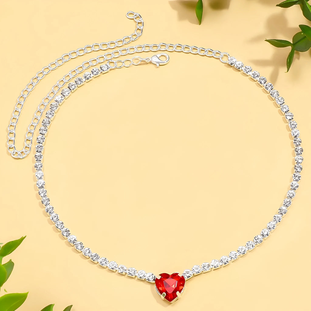 Heart pendant necklace with rhinestone crystal on a 41-50cm box chain, available in gold or silver finish.