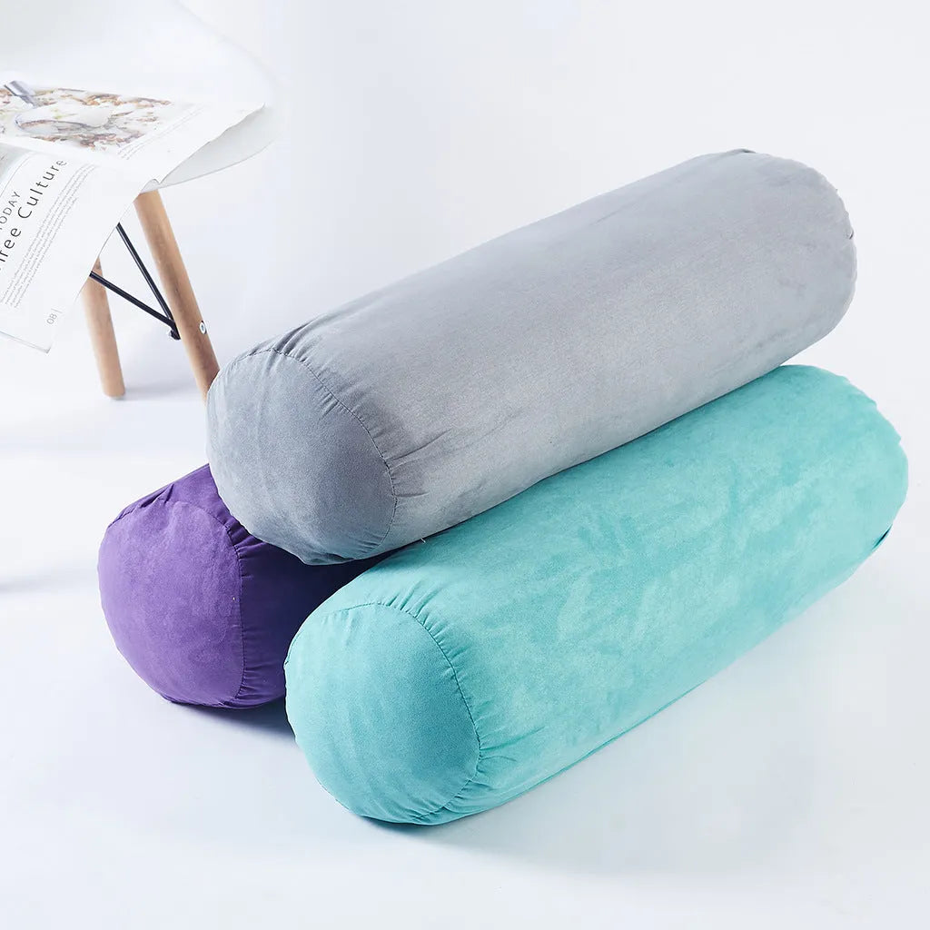 Cotton and linen yoga auxiliary pillows in four colours: blue, green, grey, purple, placed on a living room floor