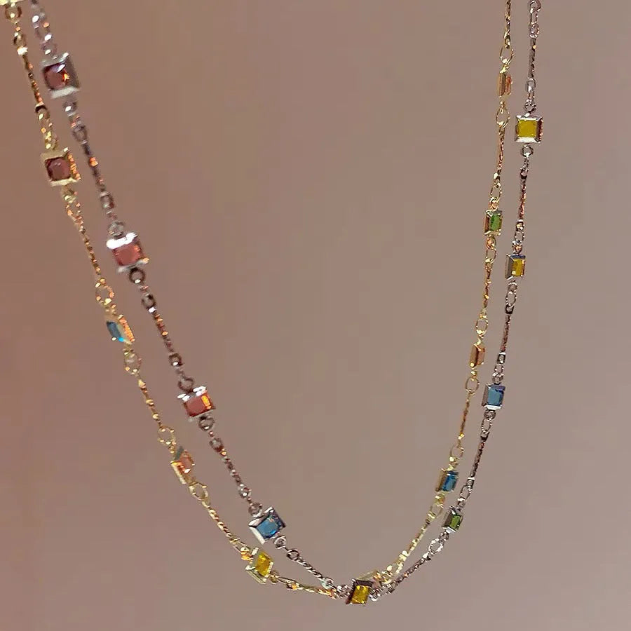 Square colour geometric clavicle chain necklace with artificial crystals in gold or white K tone finish.