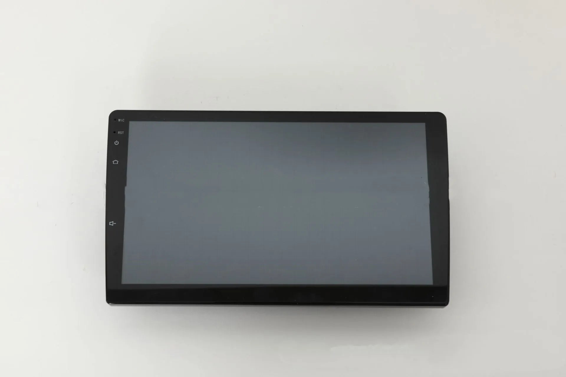 10.1 inch universal Android car stereo head unit with trapezoid touch screen display for dashboard installation.