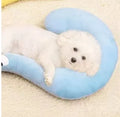 Blue and yellow U-shaped cloth pillows for cat neck support in moon and question mark designs.