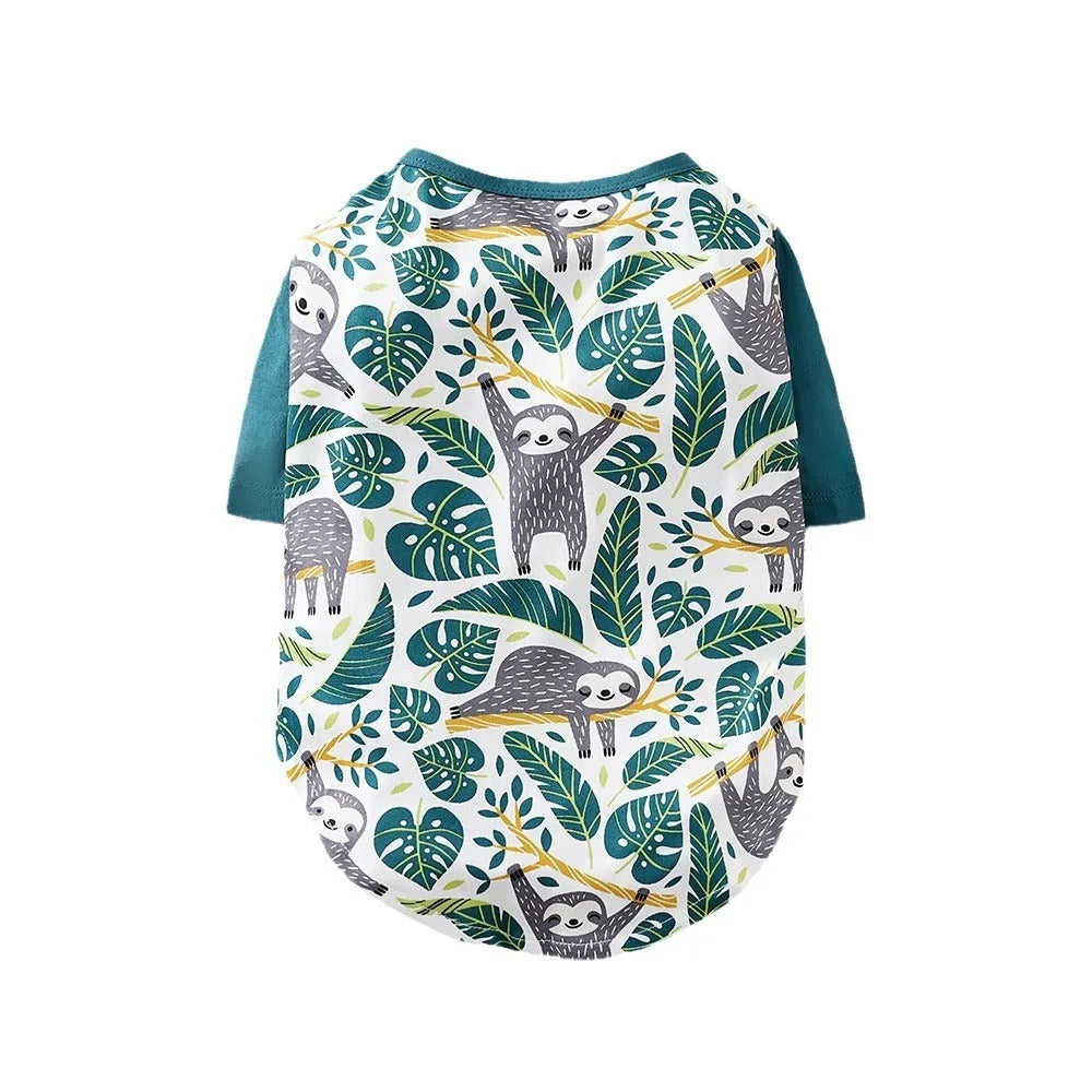 Colourful printed polyester t-shirt for a small dog, showing size chart with chest and length measurements.