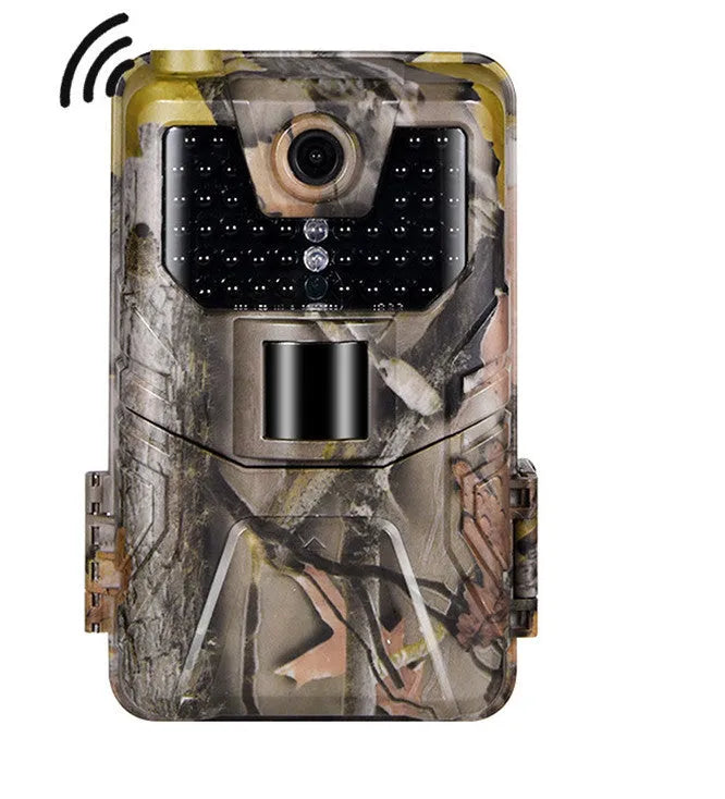 Camouflage trail camera with LCD screen showing a night-time infrared image of a deer.
