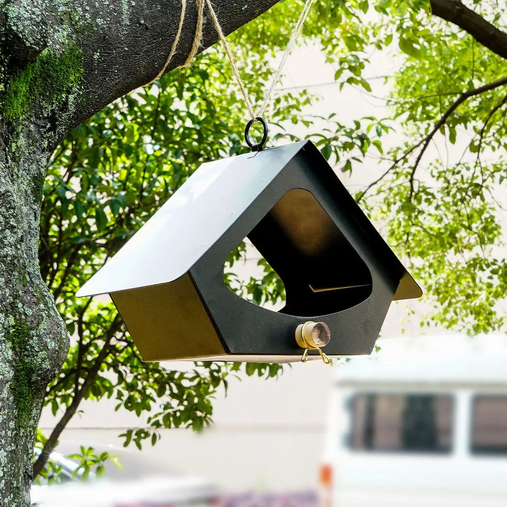 Modern simple iron bird house with anti-rain roof in garden setting