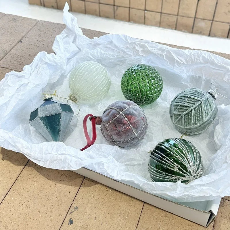 Handmade glass Christmas ball pendant 8cm in green colour hanging on tree branch