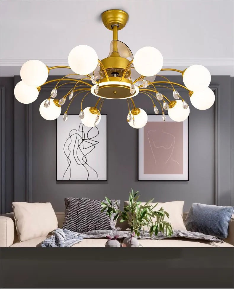 Gold and black ceiling fan lamp with chandelier-style lights and metal blades.