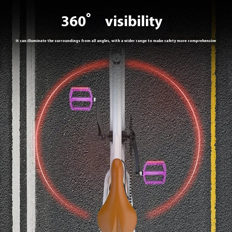 Aluminium alloy bicycle pedals with built-in 710LED lights in black, gold, purple, red, and titanium colour options.
