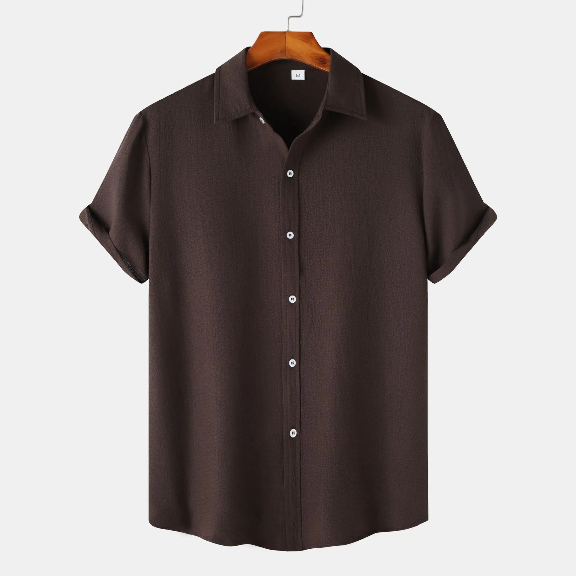 Man wearing a casual short-sleeve polyester shirt in a cardigan style, available in various colours and sizes.