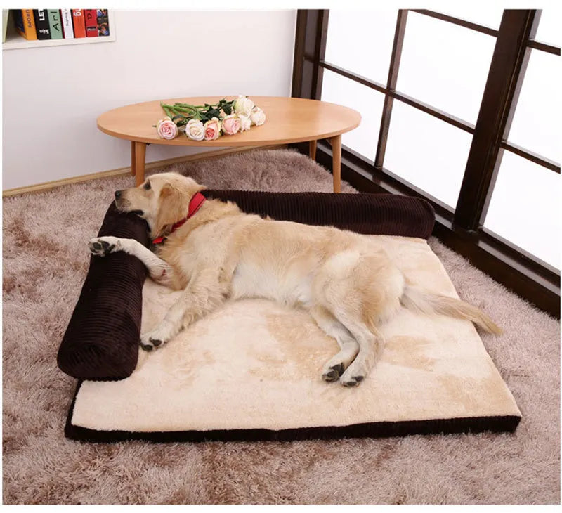 Corduroy pet sofa dog bed in grey with raised sides on a wooden floor