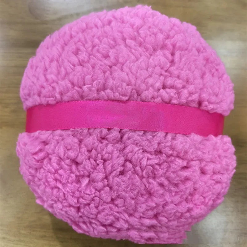 Oversized rectangular plush powder puff in pink, white, or skin colour on white background.