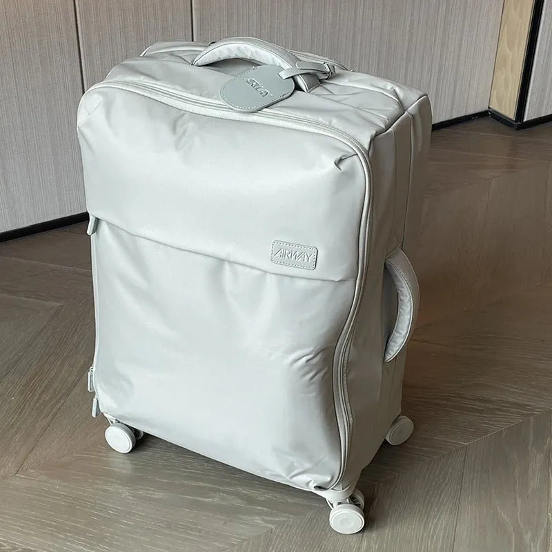 Waterproof Oxford cloth suitcase with universal wheels in bluestone green colour showing three size options