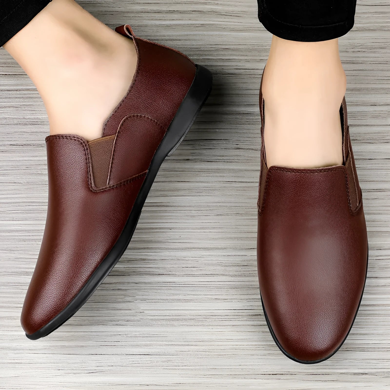 Men's black and brown leather shoes with round toe design for business casual wear.
