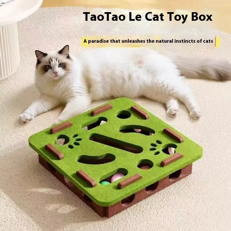 Green brown felt cube cat scratching toy with a square hole in the centre panel.