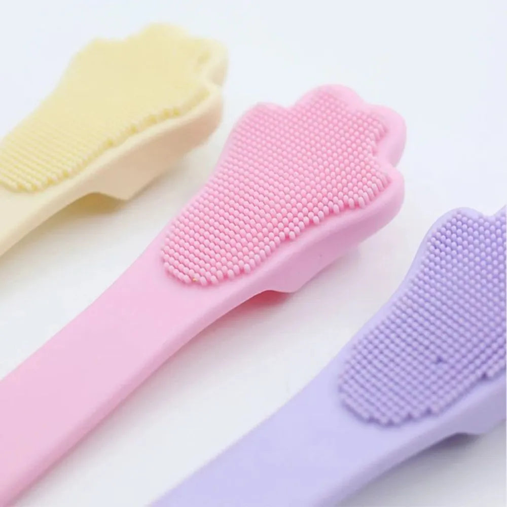 Silicone finger cover toothbrush for pet dental cleaning in pink, purple, and yellow colours.