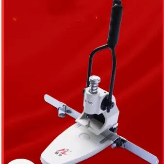 T30 single hole punching machine on desk with paper stack and adjustable pitch guide