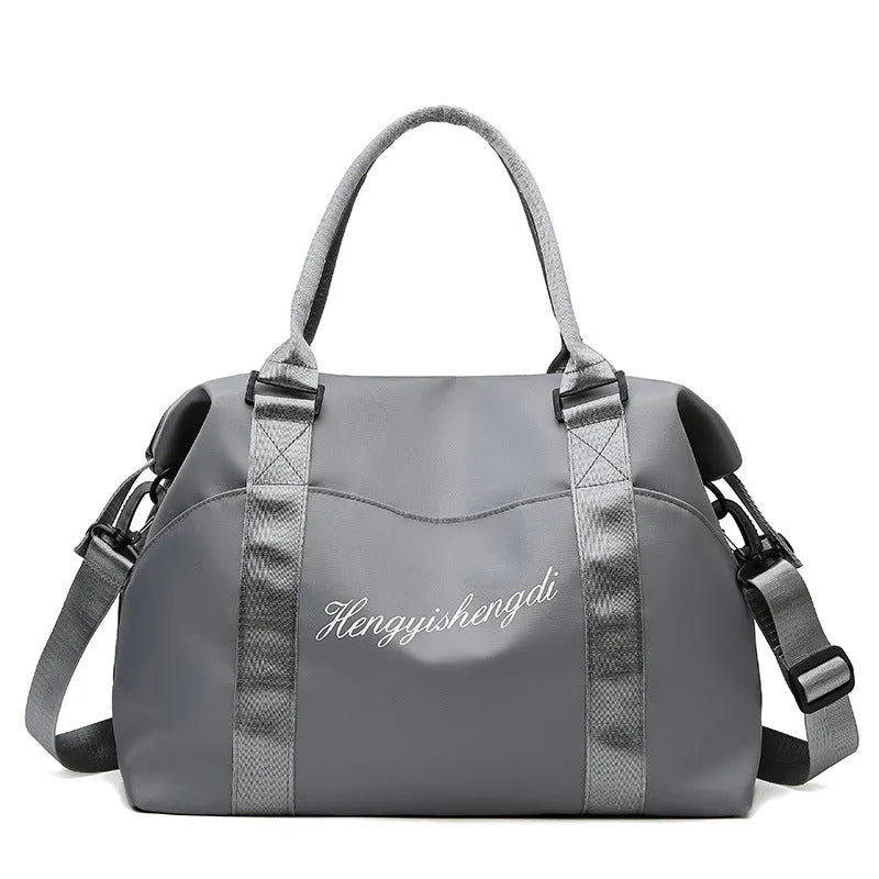 Medium 36-55L Oxford cloth travel duffel bag with zip pockets, soft handle, available in blue, black, grey and pink.