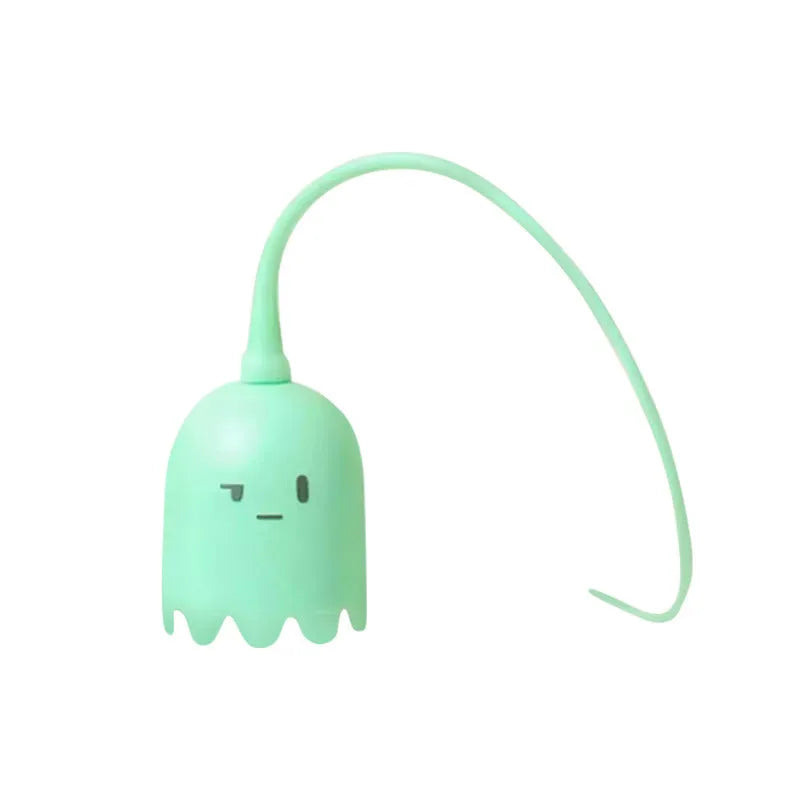 Green automatic cat wand toy with silicone tail on floor for indoor cat play