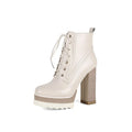 Black women's chunky heel waterproof platform boots with a side zip and round toe.
