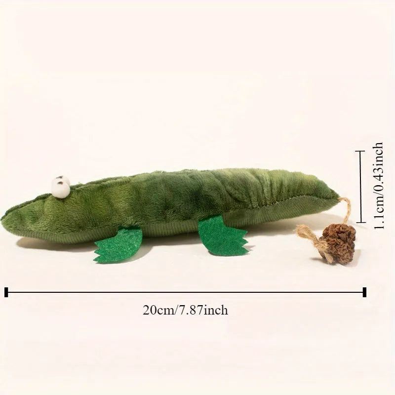 Green plush alligator cat toy with catnip and peppermint scent for oral cleansing and play.