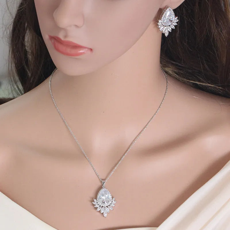 Formal jewellery set with chain, pendant, and matching earrings in blue, red, or white colours for bridal banquets.