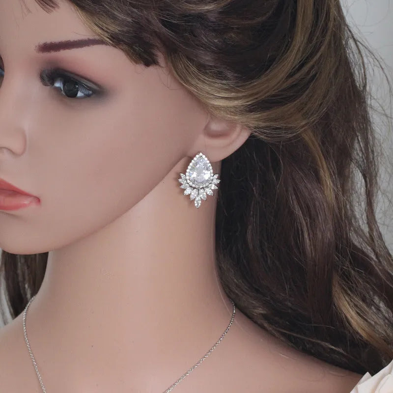 Formal jewellery set with chain, pendant, and matching earrings in blue, red, or white colours for bridal banquets.