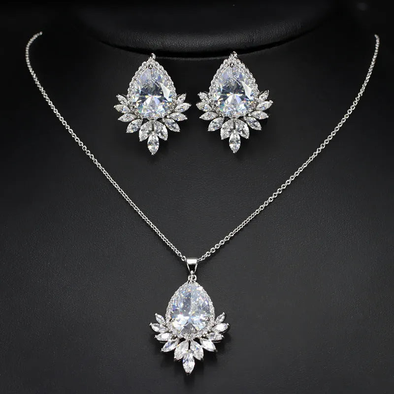 Formal jewellery set with chain, pendant, and matching earrings in blue, red, or white colours for bridal banquets.