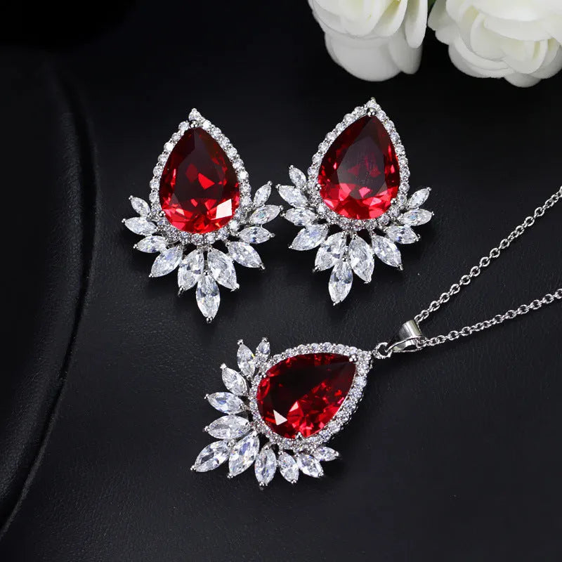 Formal jewellery set with chain, pendant, and matching earrings in blue, red, or white colours for bridal banquets.