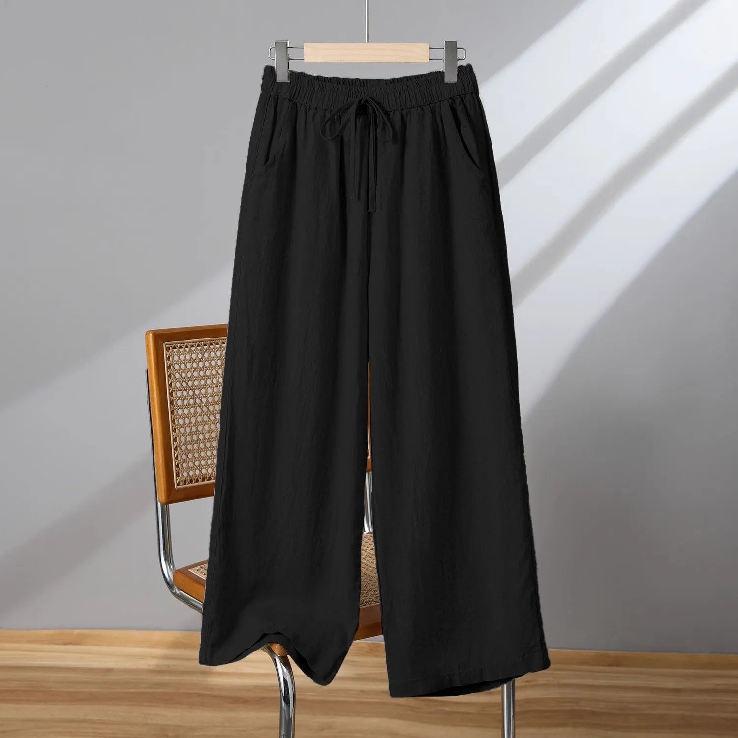 Women's straight-leg casual trousers with elastic waist and drawstring detail in apricot colour
