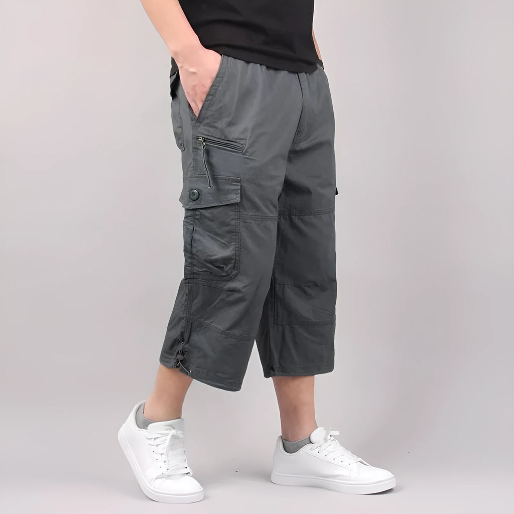 Man wearing loose-fit cotton cropped casual pants in army green colour.