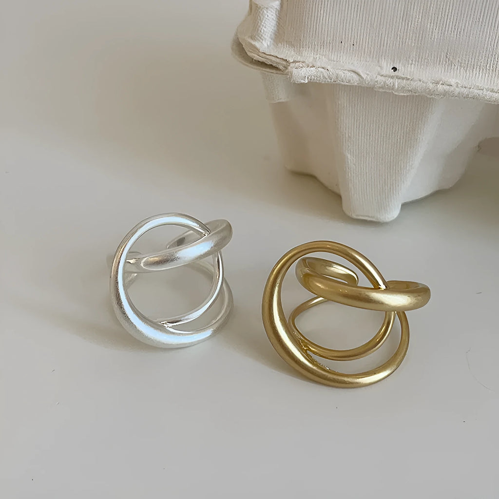 Three-dimensional interlaced geometric adjustable ring with matte metal finish and real gold electroplating