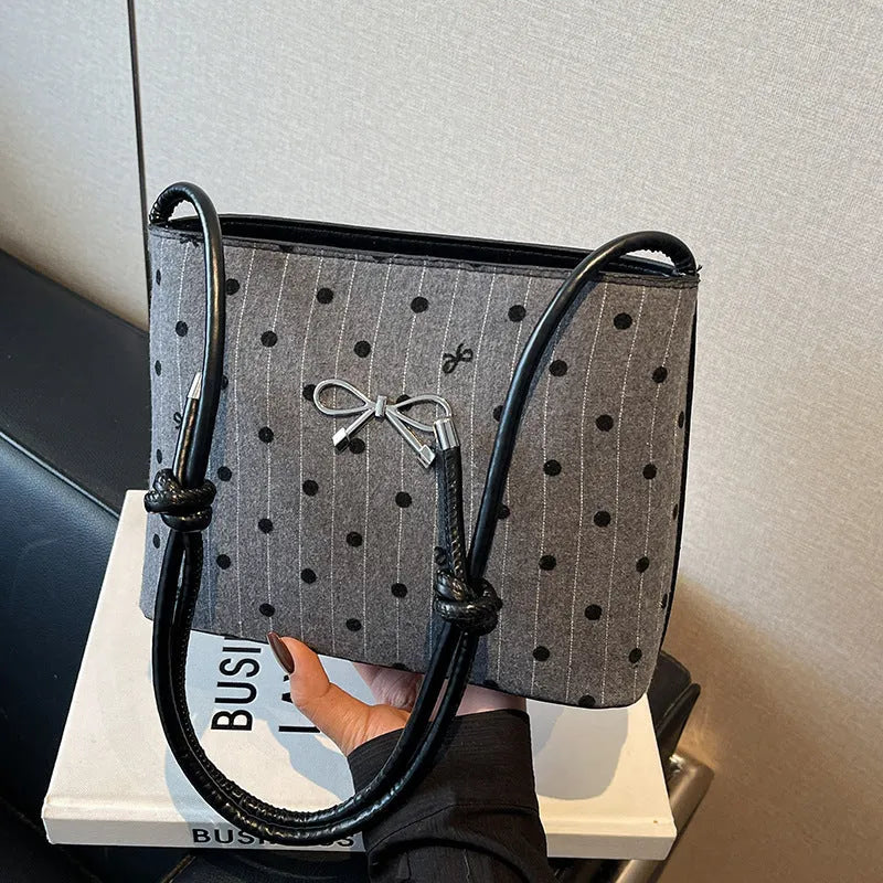 Canvas polka dot crossbody bag in bow design with double shoulder straps, hard medium shape, four colour options