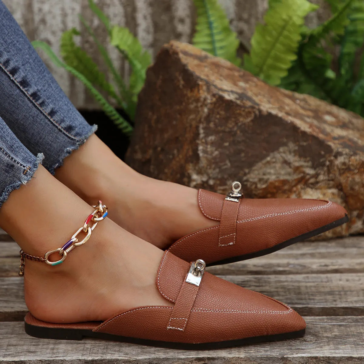 Light brown women's pointed-toe low heel semi-slippers with a PU upper and rubber sole.