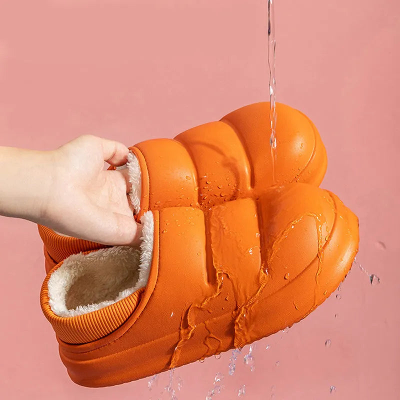A pair of waterproof EVA couple slippers in various colours, showing plush lining and a non-slip sole.