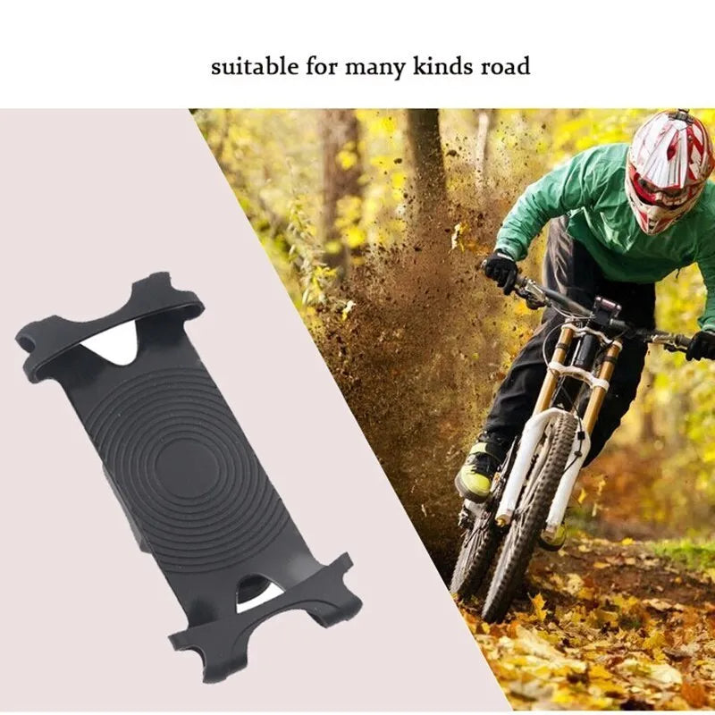 A black silicone bicycle phone holder mounted on a bike handlebar, showing the three adjustment holes and buckle fastener.
