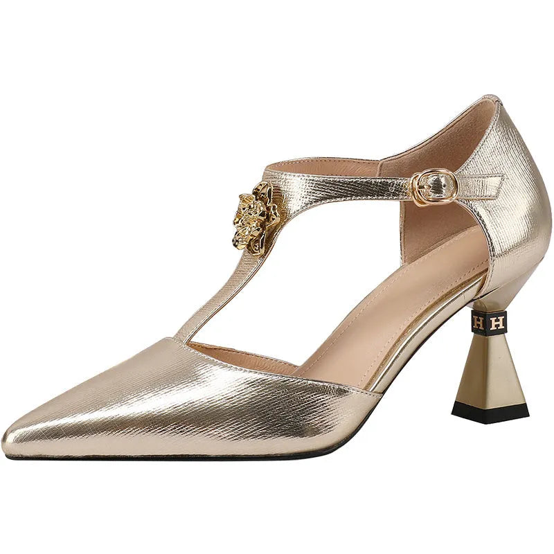 Women's gold genuine leather hollowed sandals with pointed toe and heel on a white background.