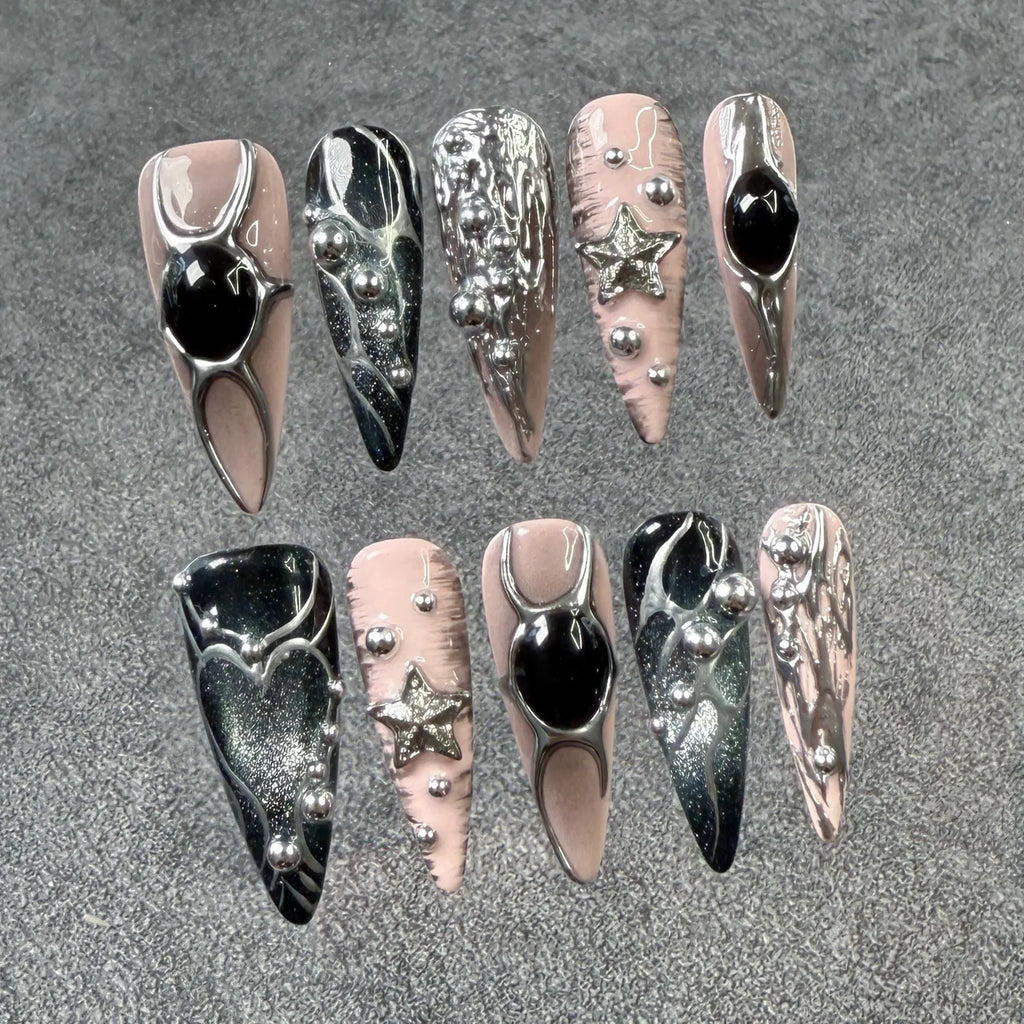 Set of long pointed dyed nails with metal hand-painted relief and cat eye finish in multiple sizes