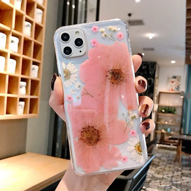 Floral TPU iPhone case with large pink and yellow flower patterns on back cover.