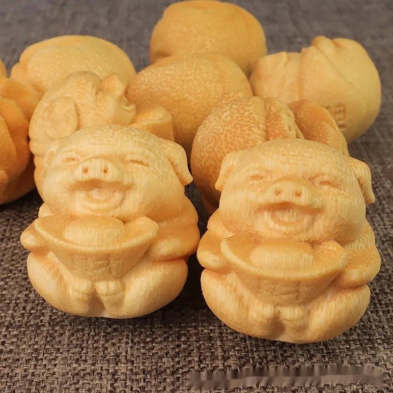 Handcrafted solid bamboo pig carving ornament with 4cm height and 3.5cm diameter dimensions