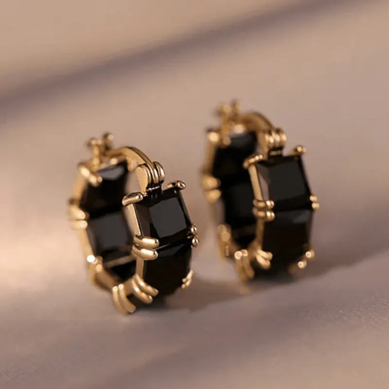 Geometric U-shaped gold ear ring with round black zircon stones