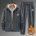 Grey men's casual sports suit with hooded sweater and matching trousers laid flat.