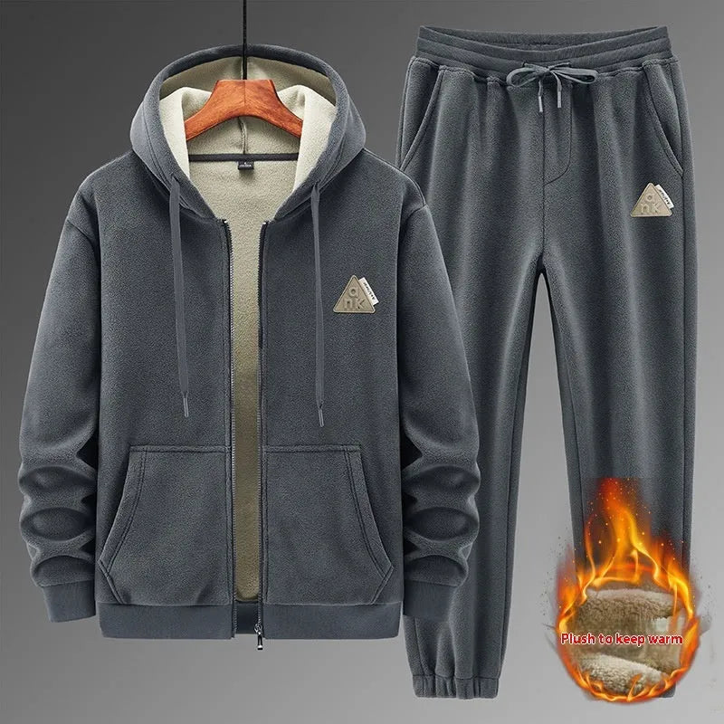 Grey men's casual sports suit with hooded sweater and matching trousers laid flat.