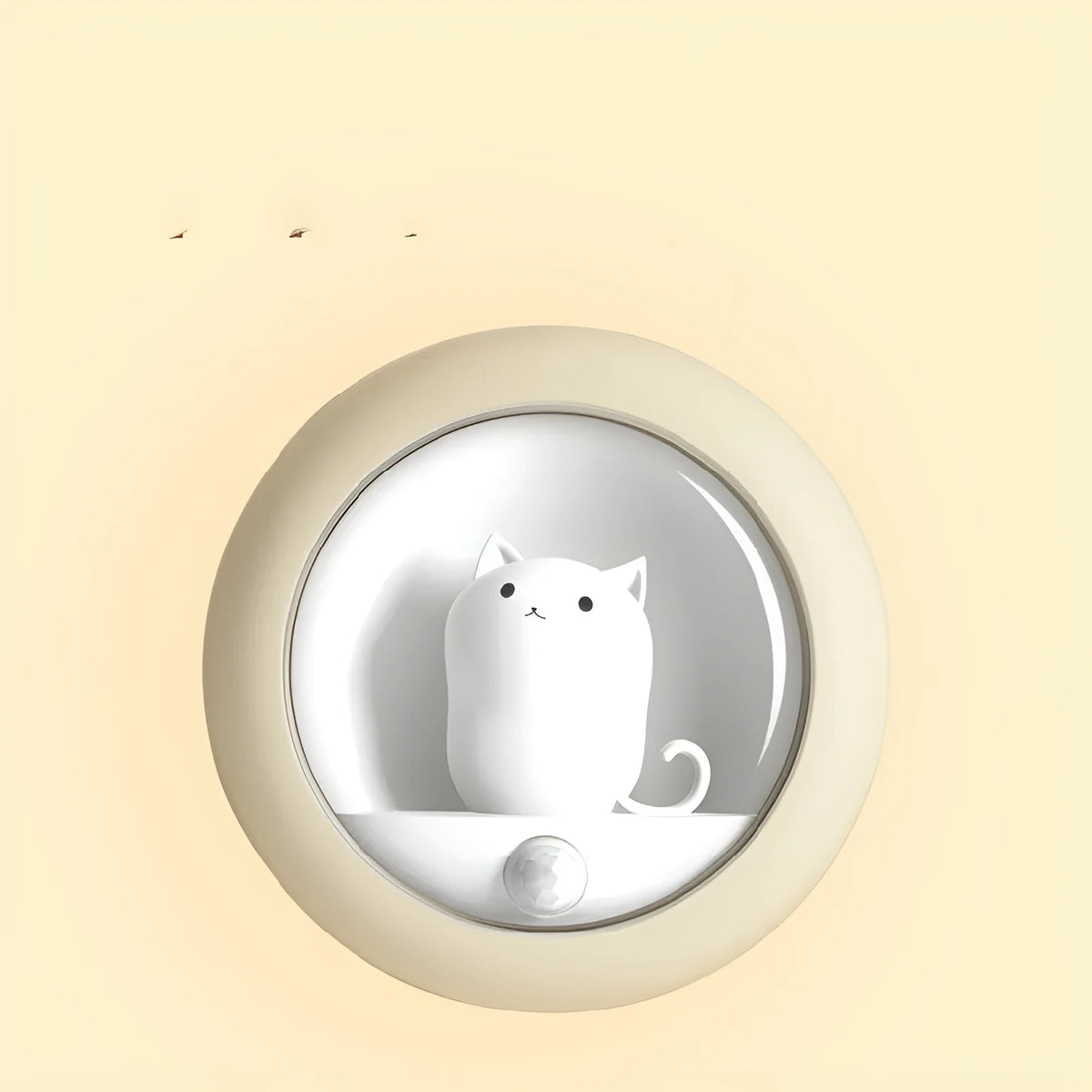 A white bedside sleep lamp for babies with orange, pink, and white light options and a projection feature on a nursery table.