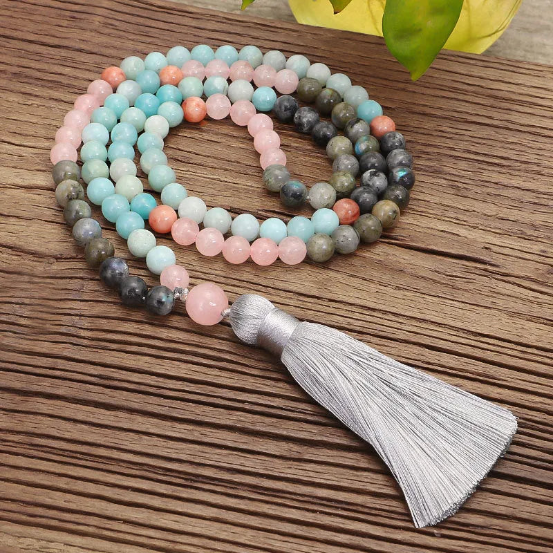 Bohemian 108 colourful stone necklace with drop-shaped tassel pendant on white background